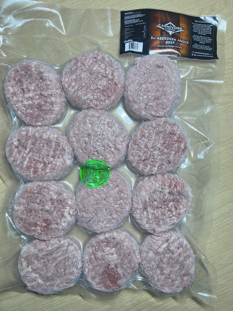 Packaged beef patties with a visible brand label on a wooden surface